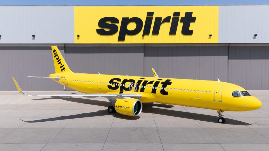 Spirit Airlines Airbus A321neo in front of a hangar
