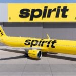Spirit Airlines Airbus A321neo in front of a hangar