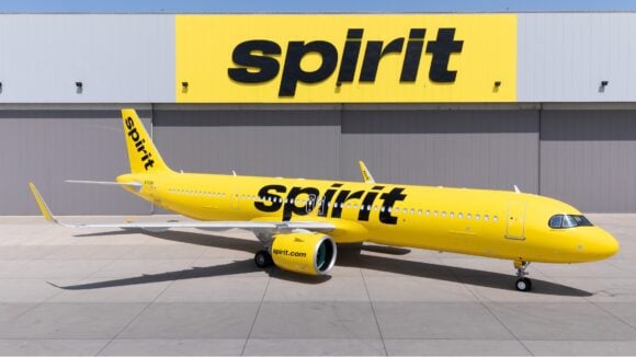Spirit Airlines Airbus A321neo in front of a hangar